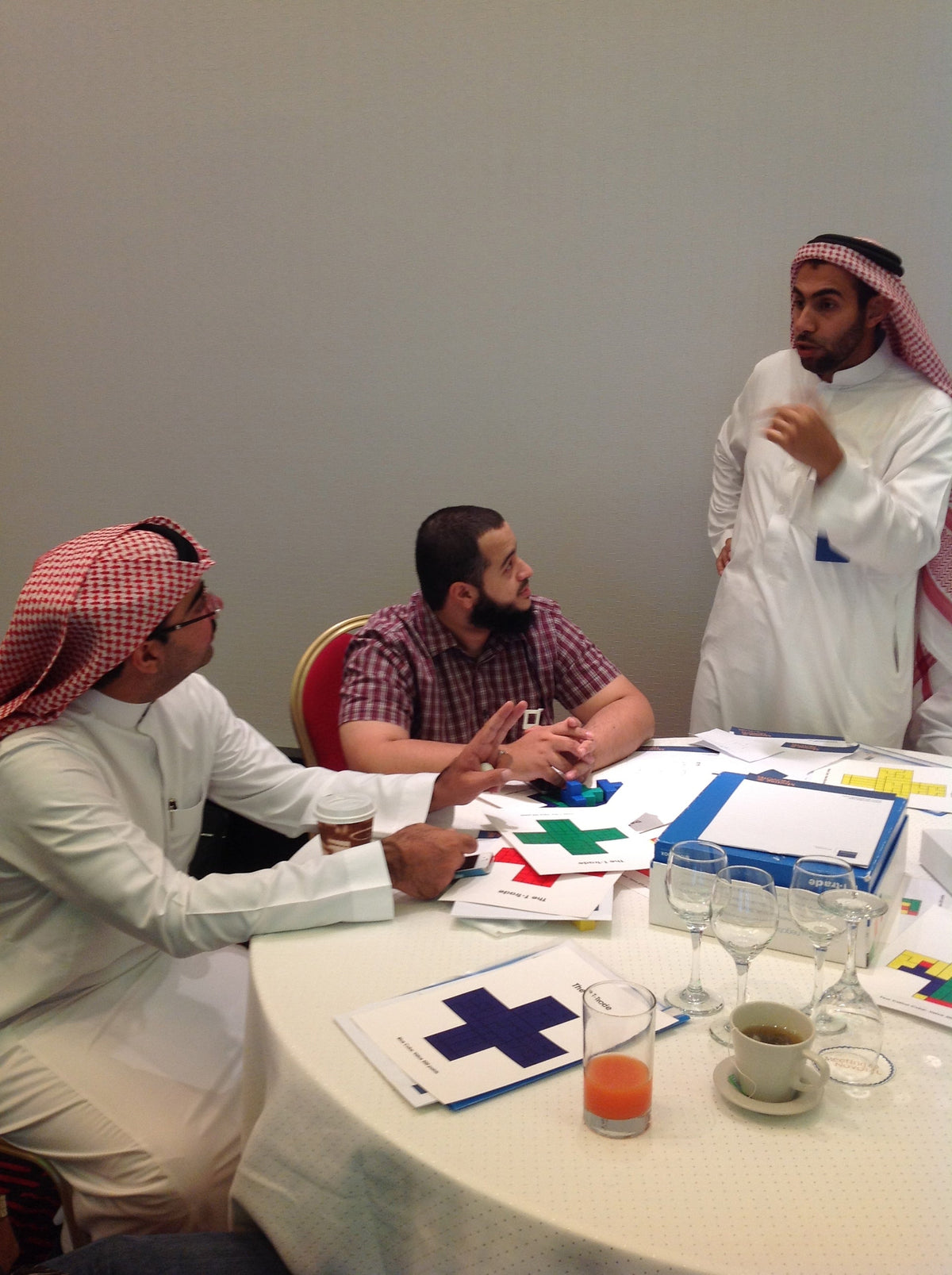 Group discussing T-Trade experiential learning activity