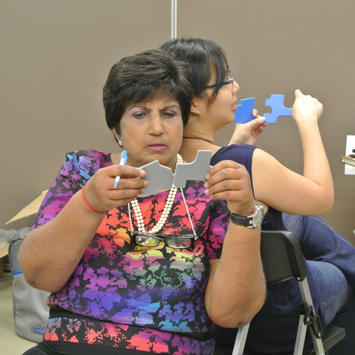 Two participants completing the paired Colourblind Plus activity