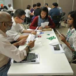 Counter Intelligence Experiential Learning Activity - participants reading cards in gameplay